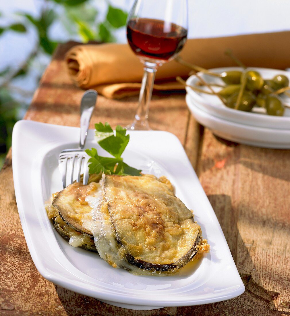 Aubergine & cheese sandwiches with capers & a glass of red wine