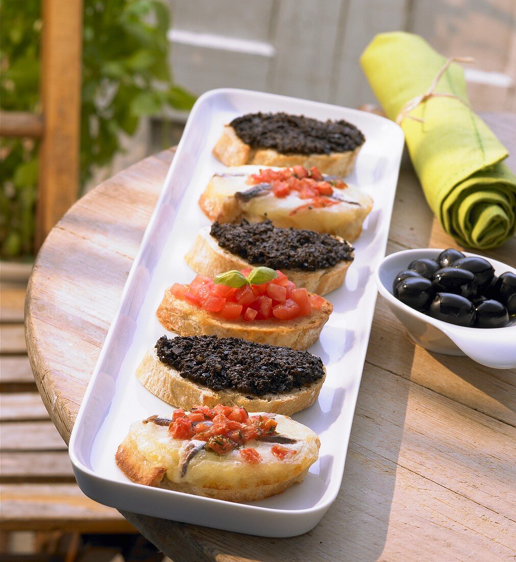 Assorted crostini on an appetiser platter