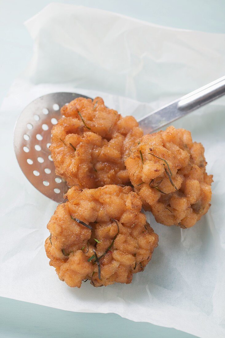 Three deep-fried, spicy salmon cakes