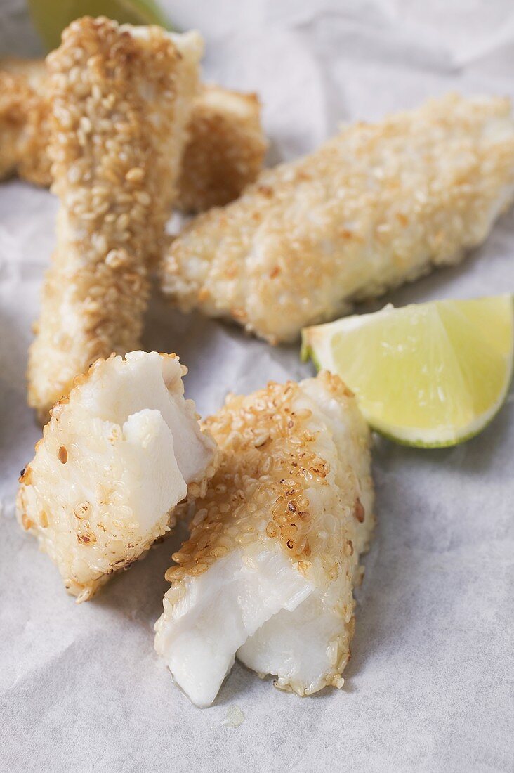 Several sesame-coated, deep-fried fish fingers