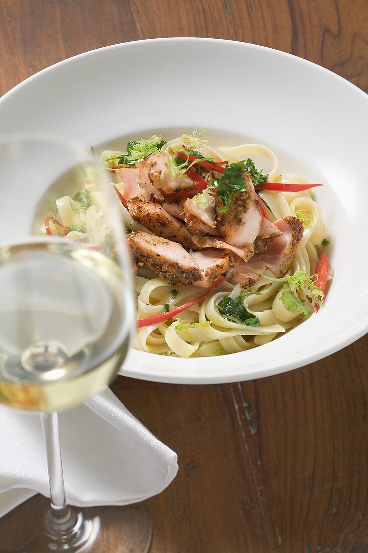 Ribbon pasta with fried peppered salmon, red pepper & wine