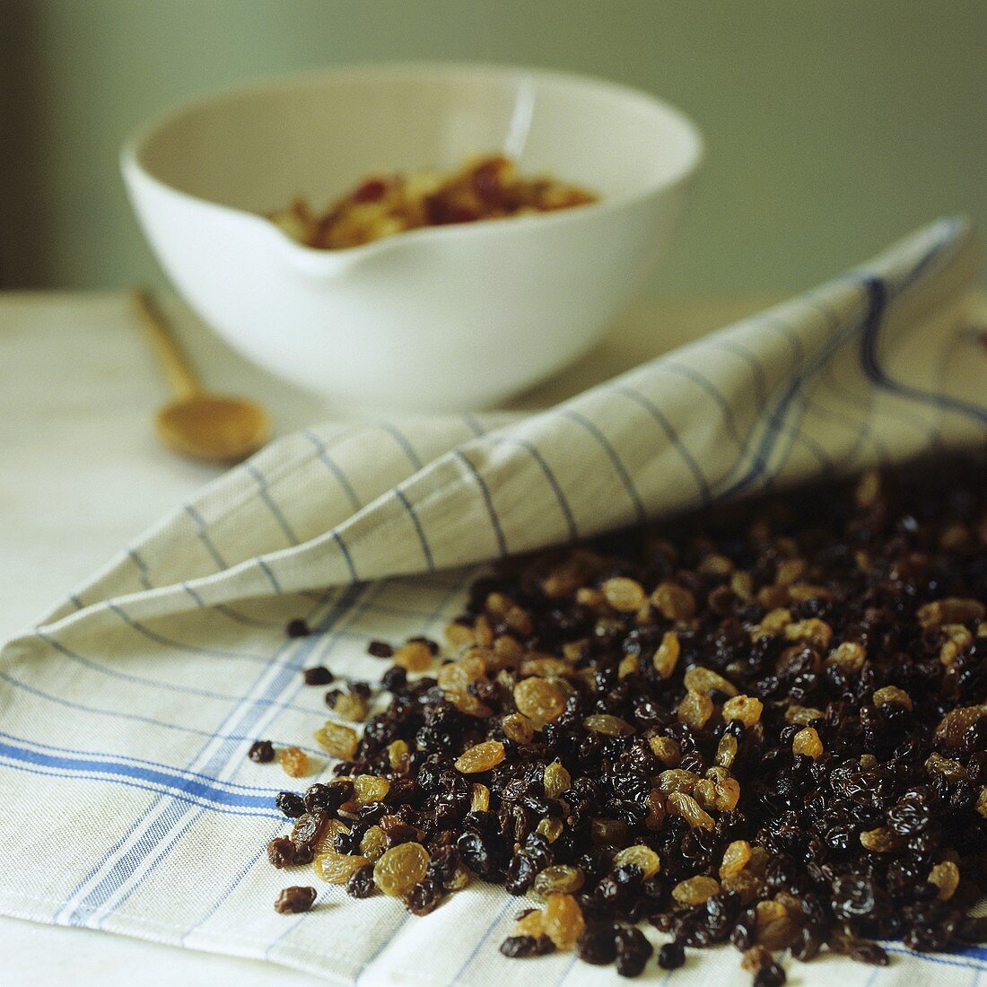 Draining washed raisins and sultanas on tea towel