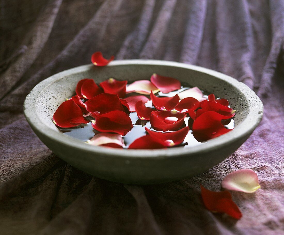 Rose petals in a stone bowl