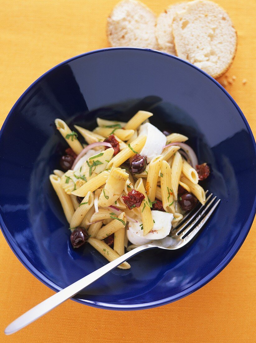 Pasta salad with artichokes, olives and buffalo mozzarella