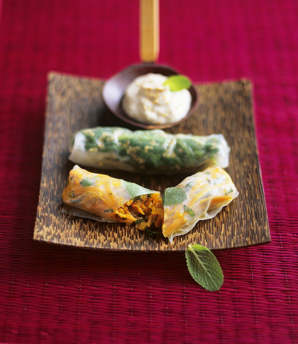 Vegetables in rice paper with tahini dip