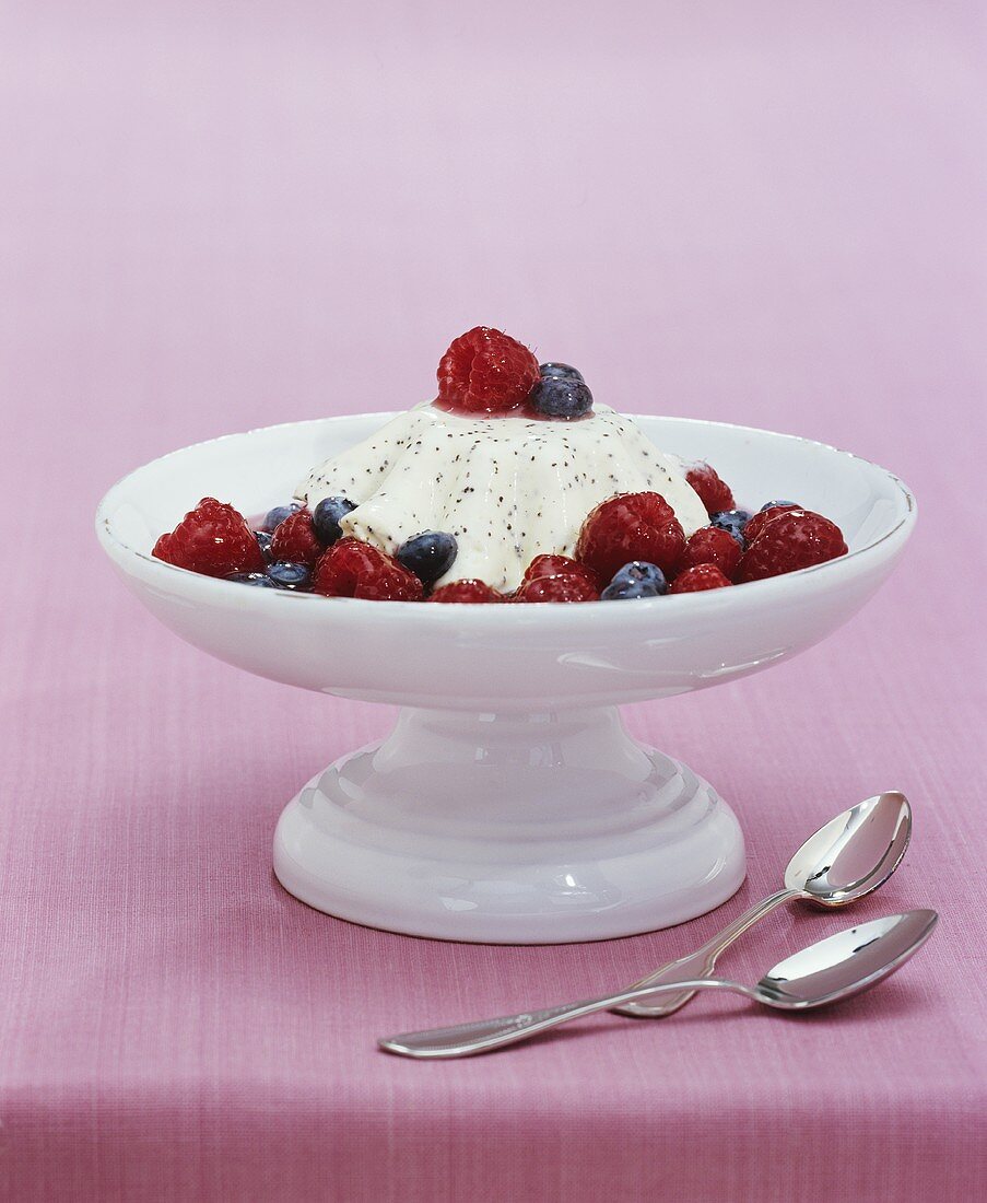 White chocolate mousse with berry sauce