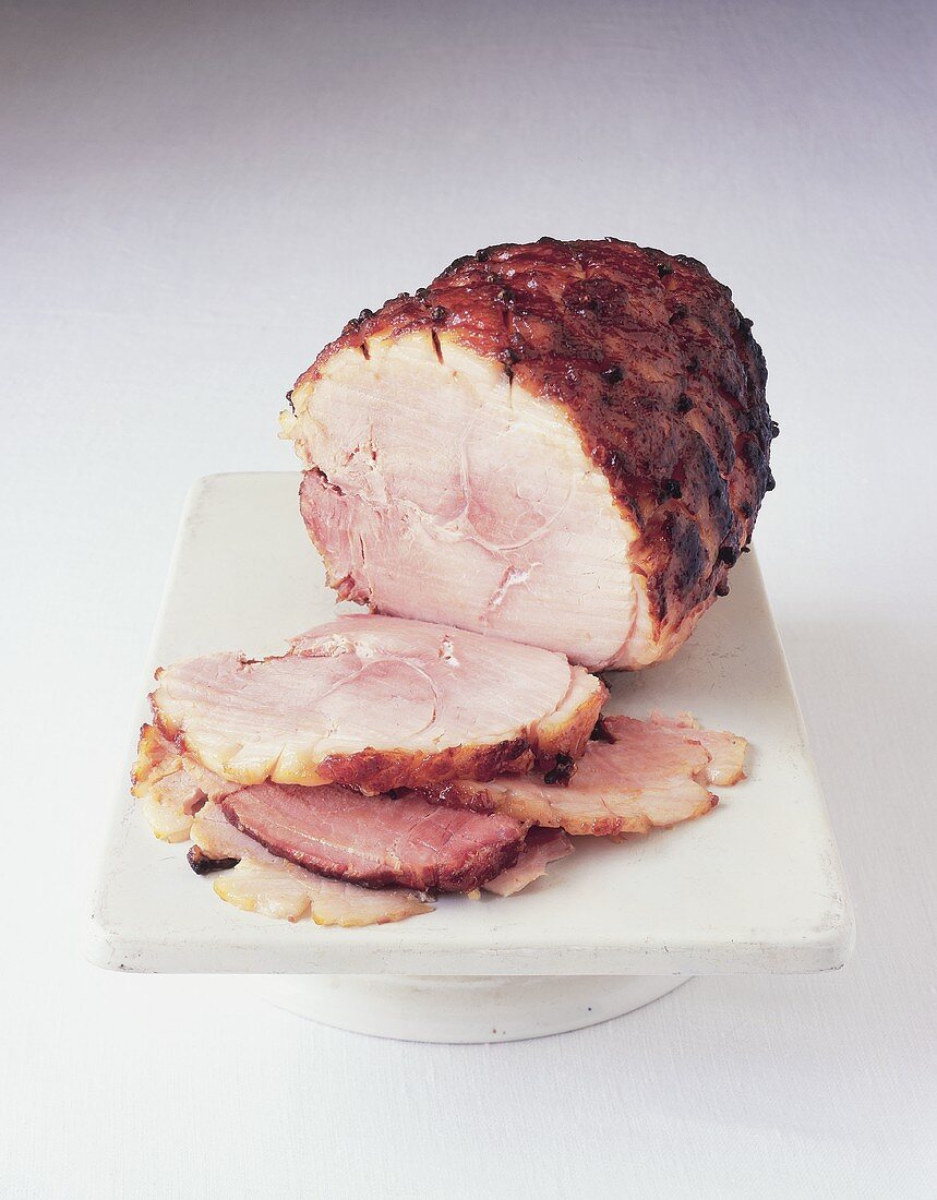 Glazed roast ham, partly carved