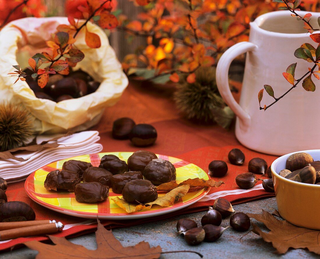Glazed sweet chestnuts, sweet chestnuts and autumn leaves
