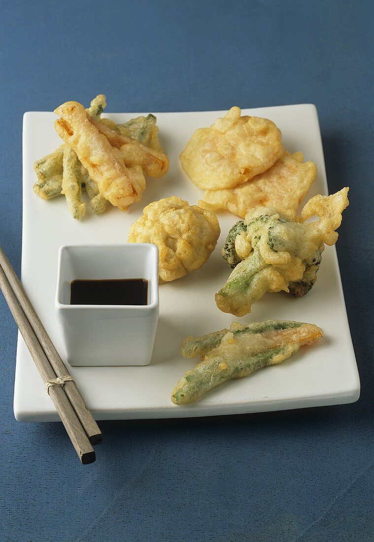 Deep-fried vegetables in tempura batter with soy sauce