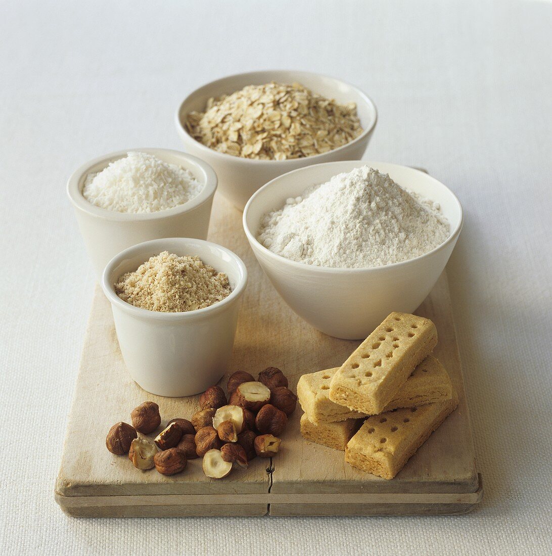 Various toppings for crumbles on a wooden board