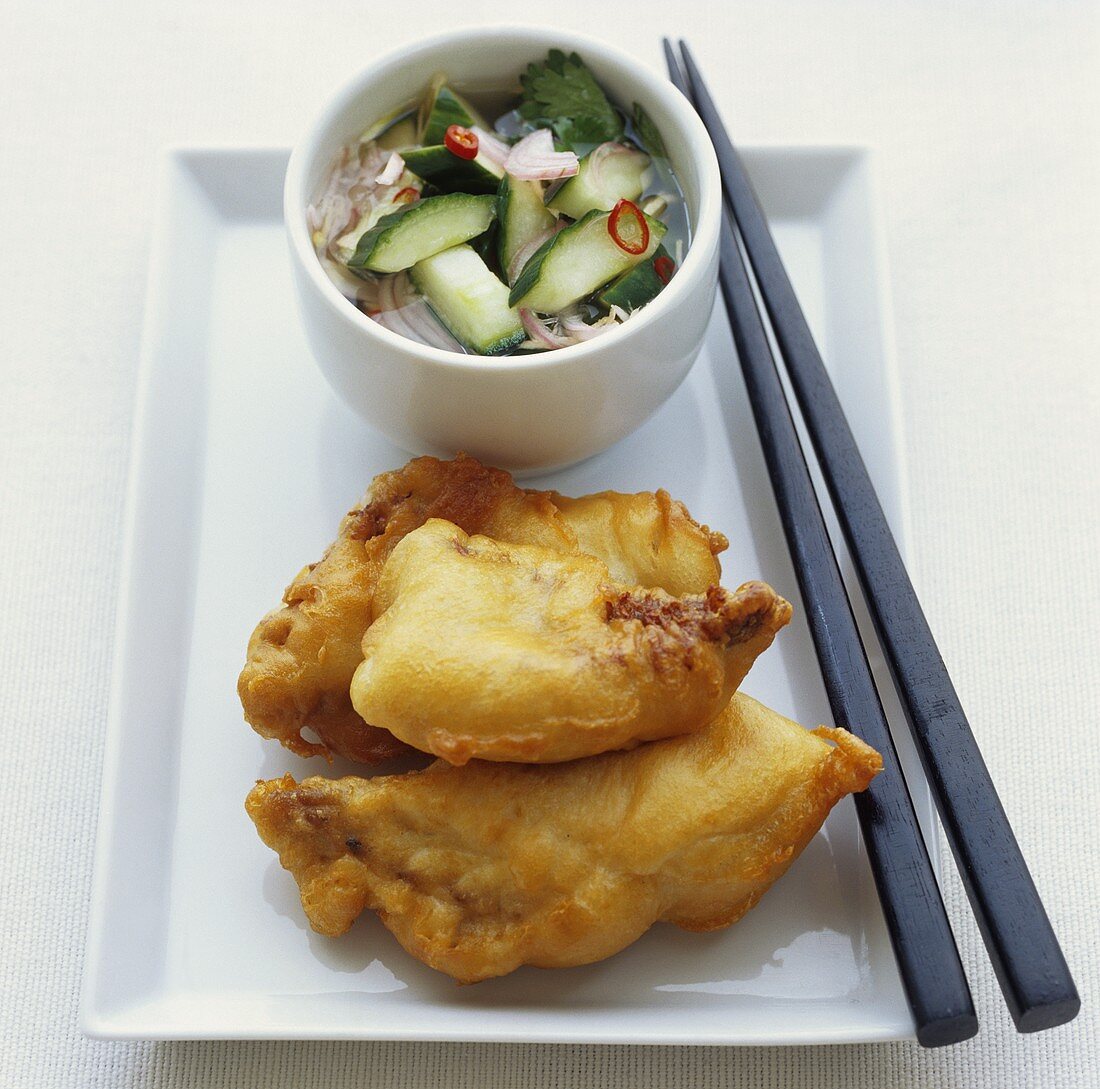 Fried fish in batter with vegetable salad