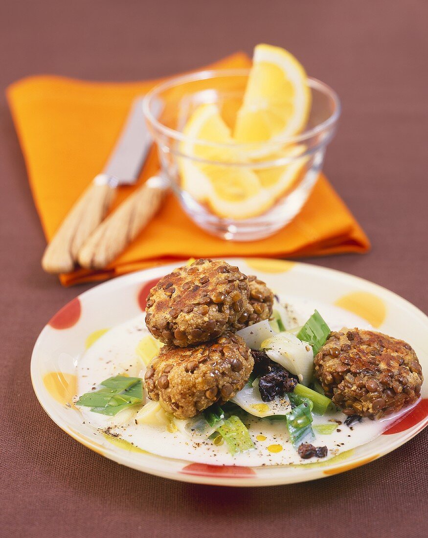 Lentil burgers on leeks and currants