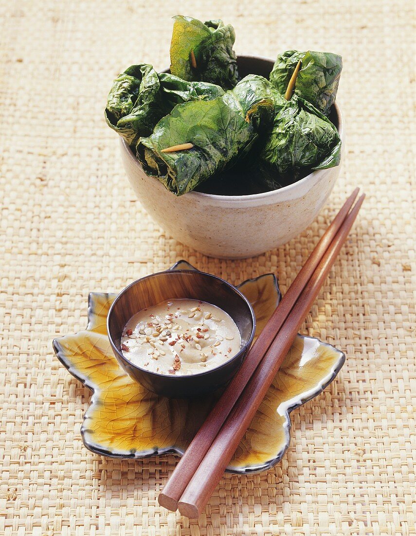 Deep-fried stuffed lettuce leaves with sesame dip