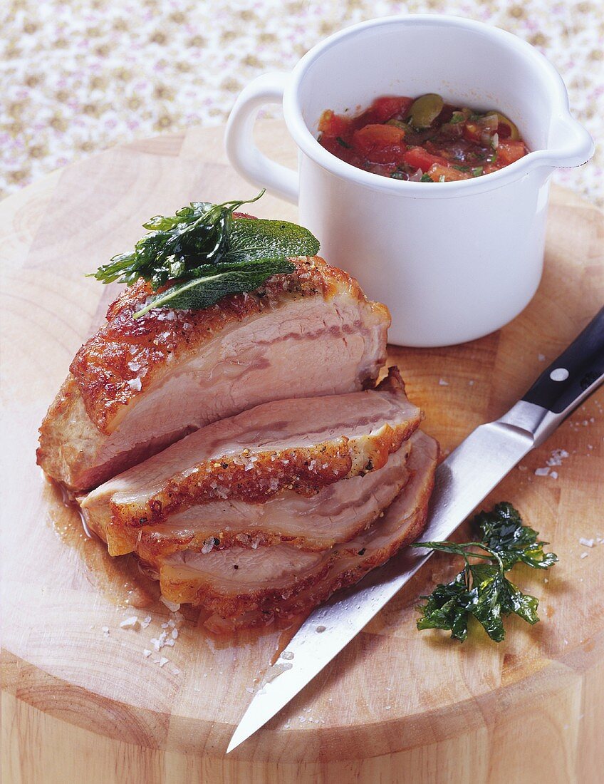 Loin of veal with herbs and olive and tomato sauce