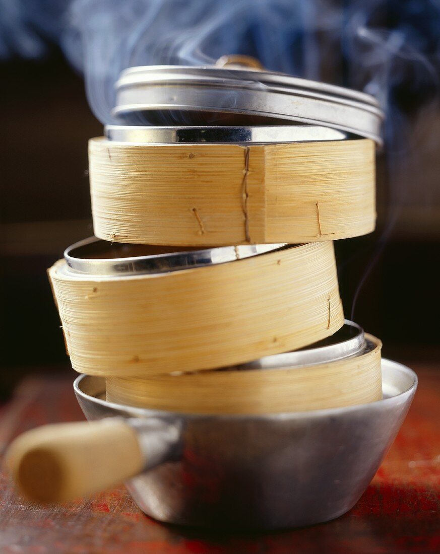 Steaming baskets in a saucepan