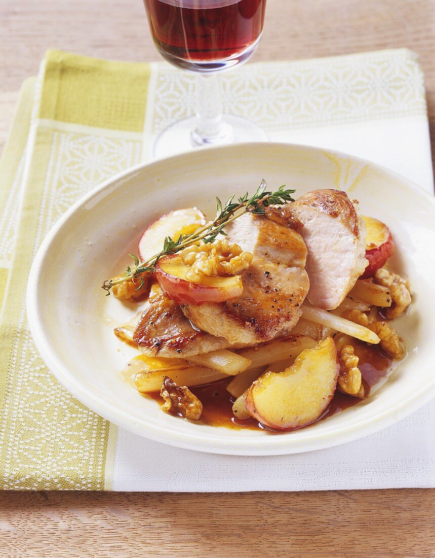 Fried pheasant breast with apples and walnuts