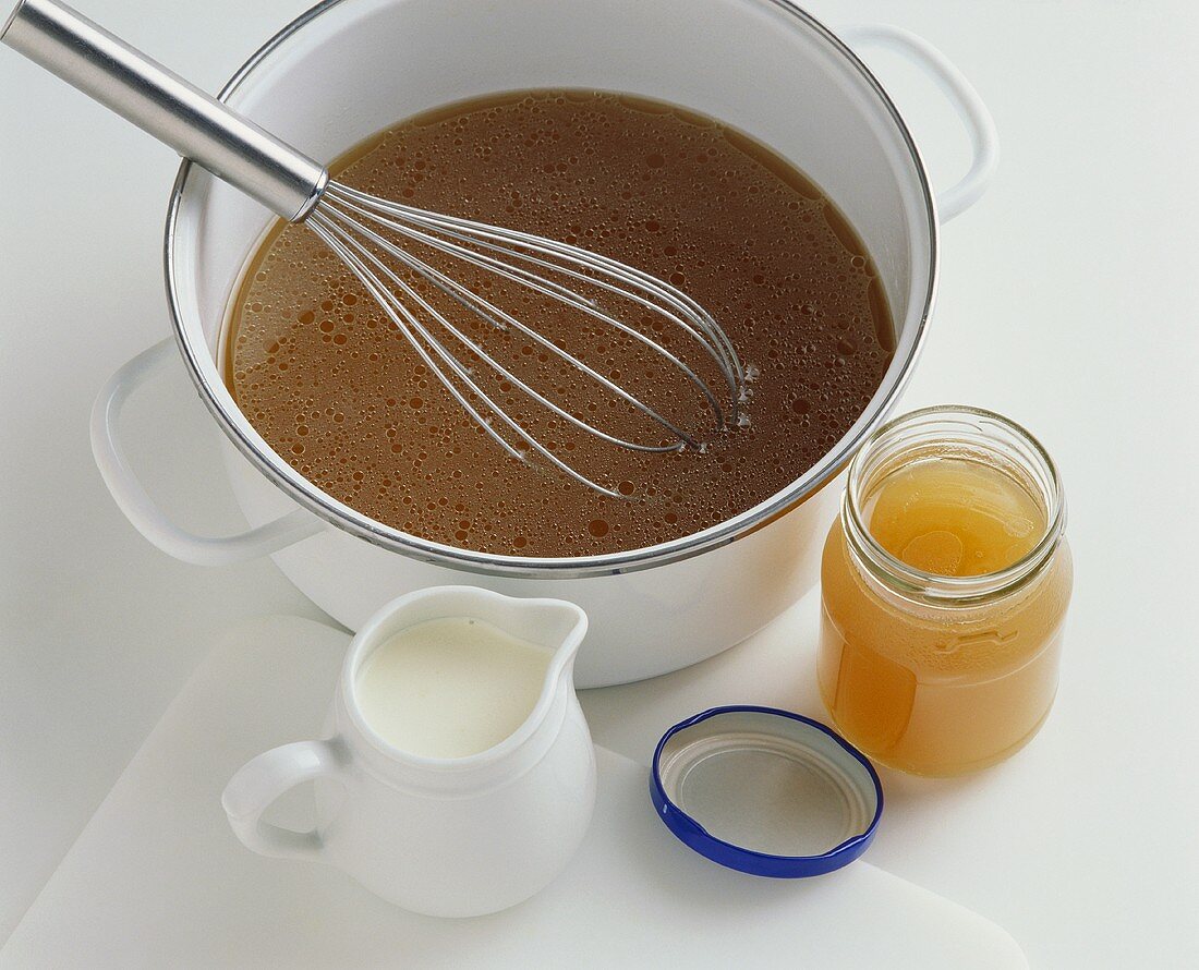 Stock in jar and pan, small jug of cream