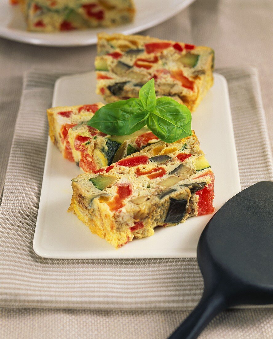 Vegetable terrine made with tomatoes, aubergines & courgettes
