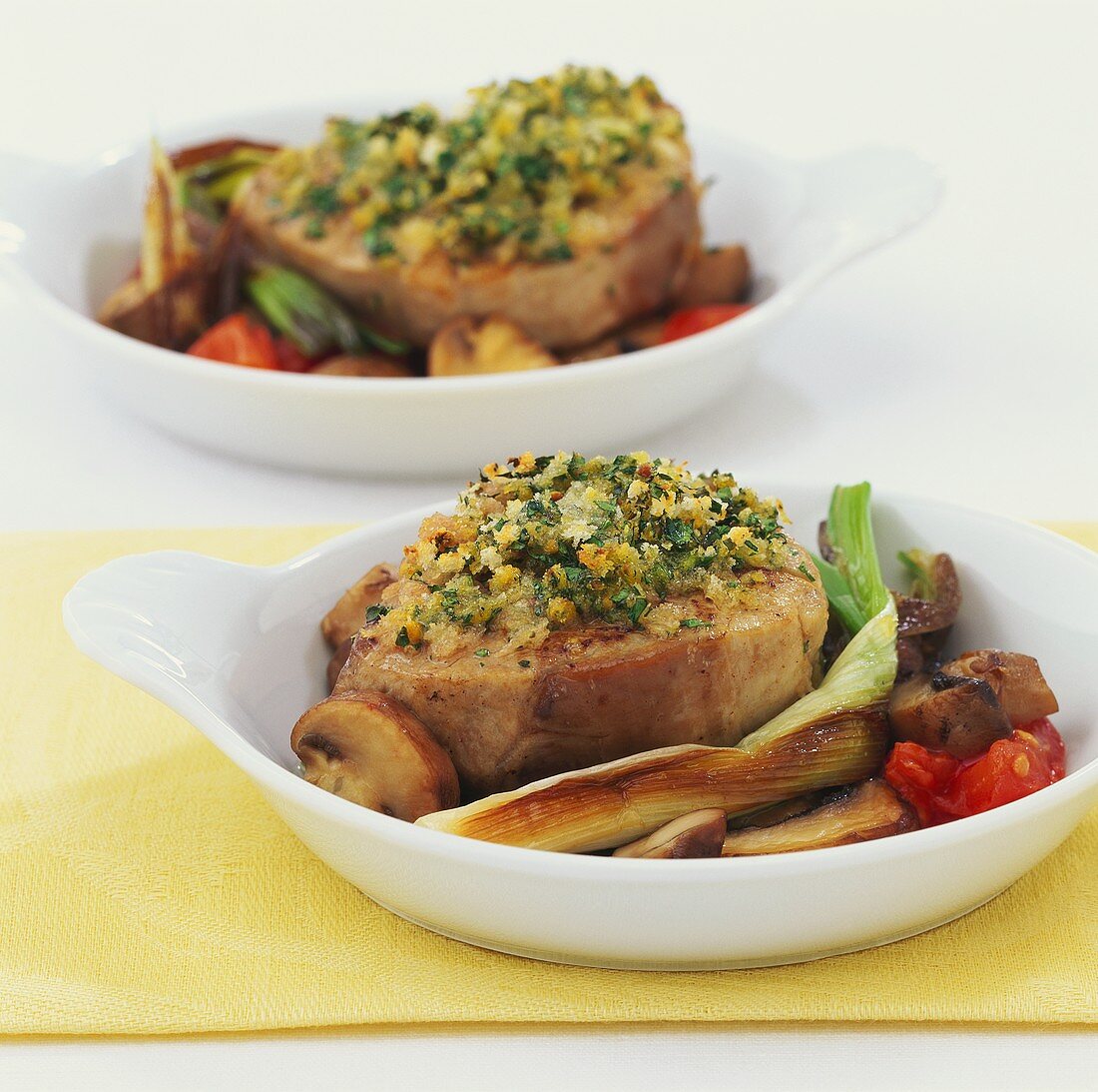 Medallions of veal with herb crust on vegetables