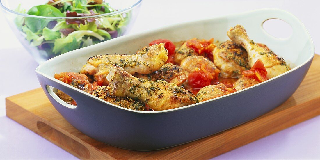 Chicken legs with potatoes and tomatoes