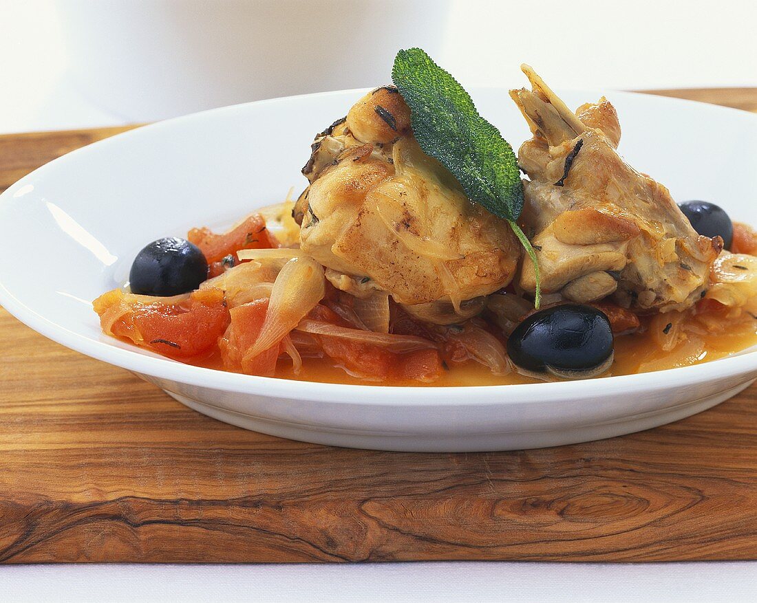 Braised rabbit with tomatoes and olives