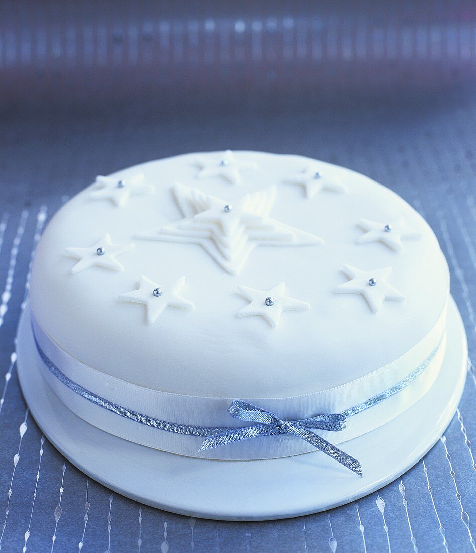 Iced Christmas cake decorated with stars
