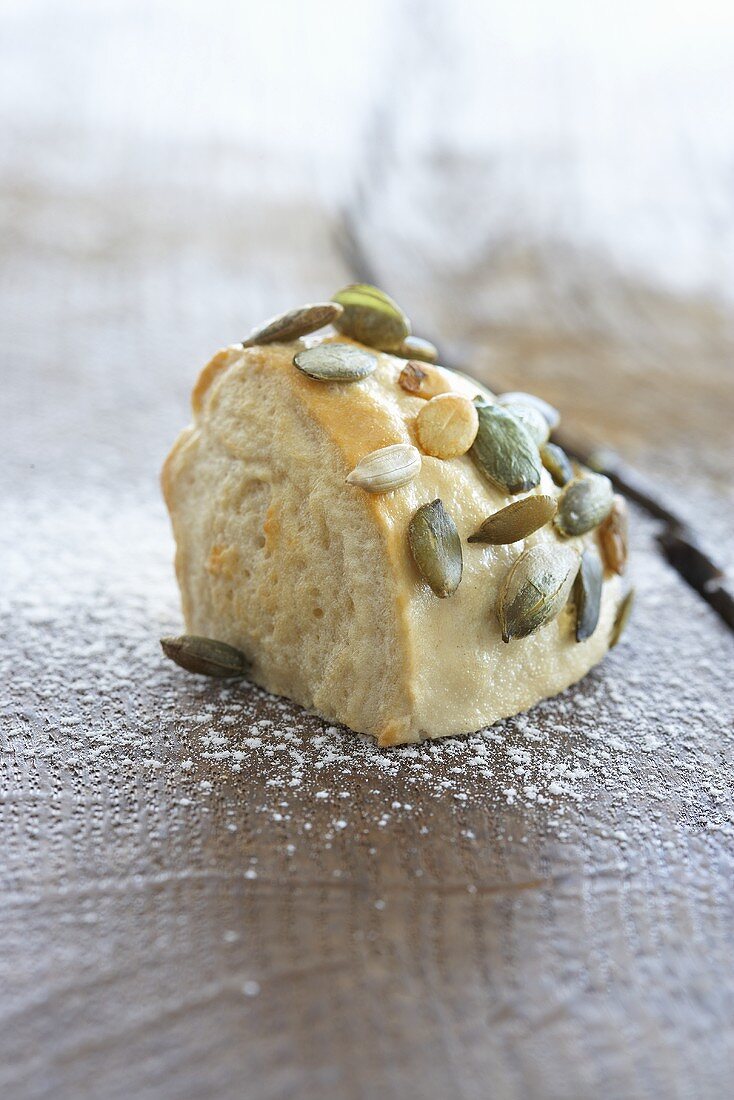 Pumpkin seed roll on a wooden surface