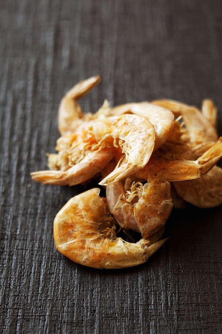 Dried shrimps on a wooden surface