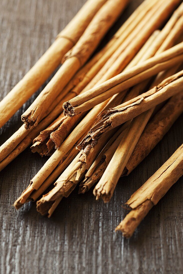 Cinnamon sticks on a wooden surface