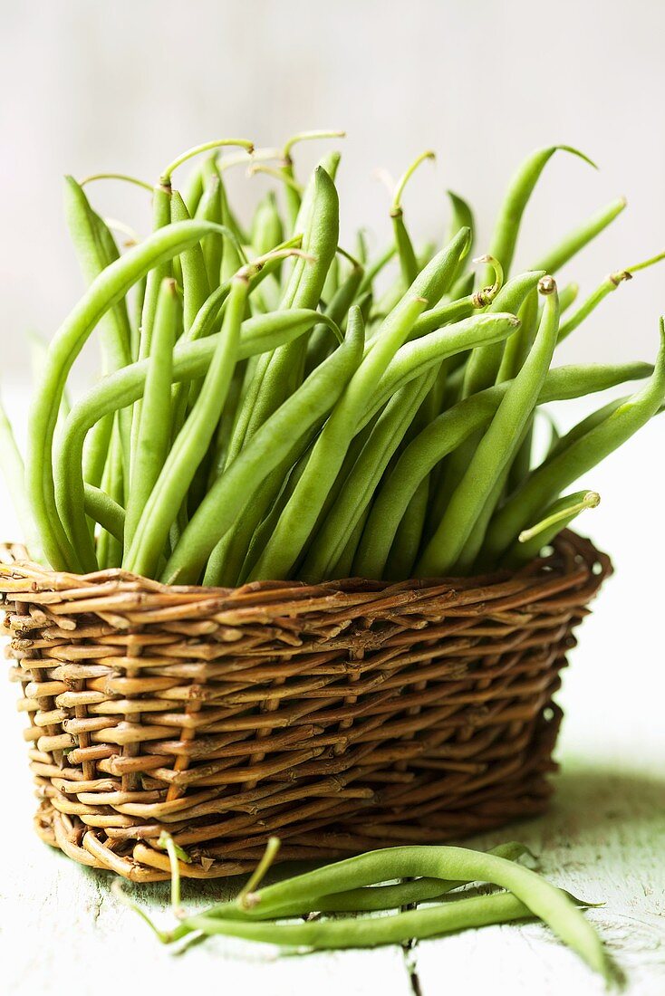 Lots of green beans in a basket