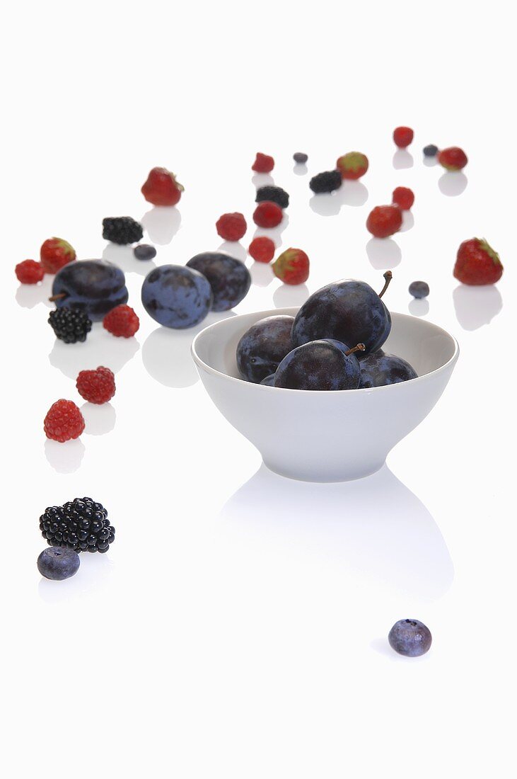 A bowl of damsons and various berries