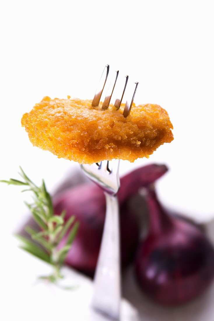 A chicken nugget on a fork