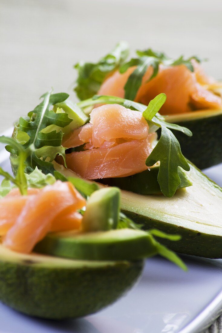 Avocados filled with smoked salmon and rocket