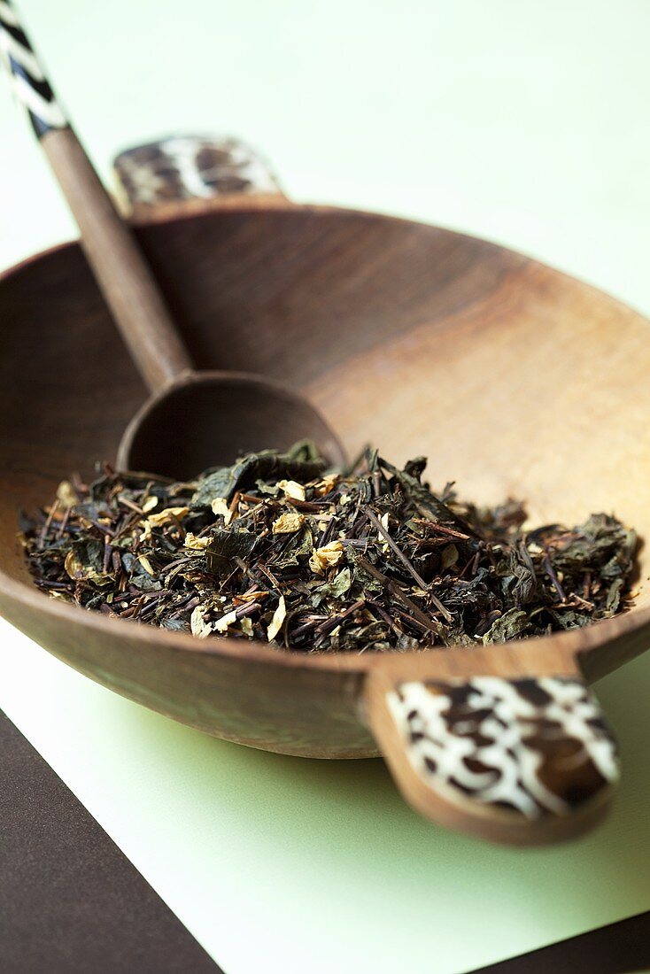 Green tea from Vietnam in a wooden bowl