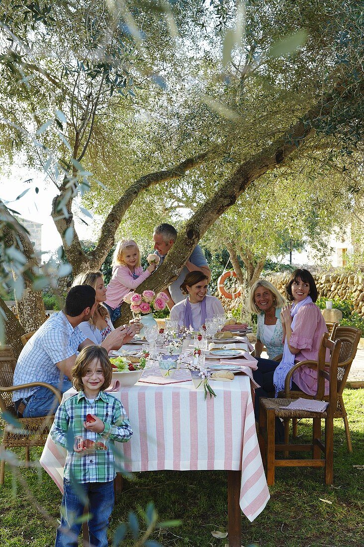 A family and friends at a garden party