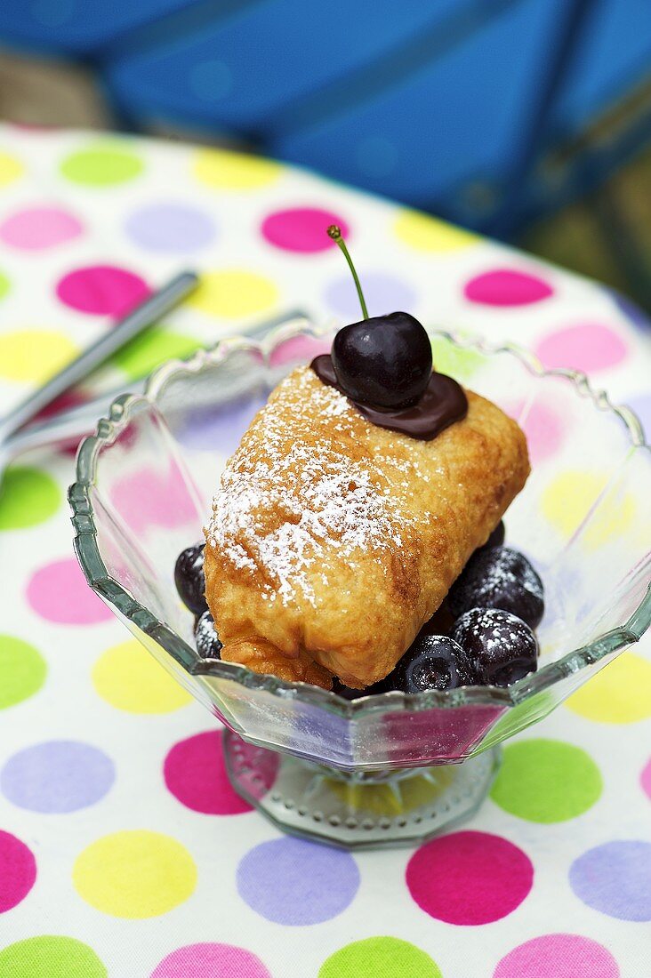 Ice cream in puff pastry with cherries