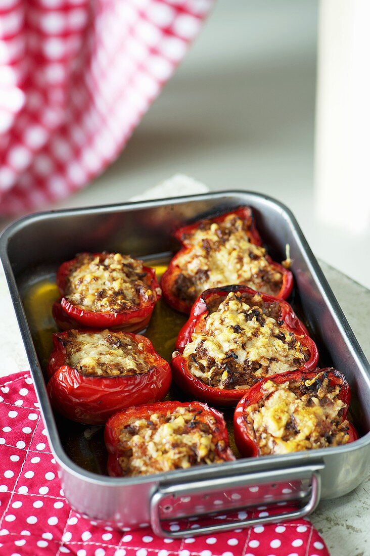 Stuffed peppers in a roasting tin