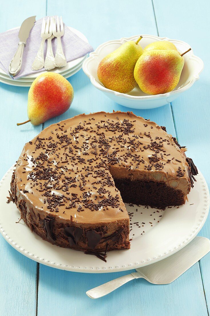 Chocolate cake with pears and chocolate mousse, sliced