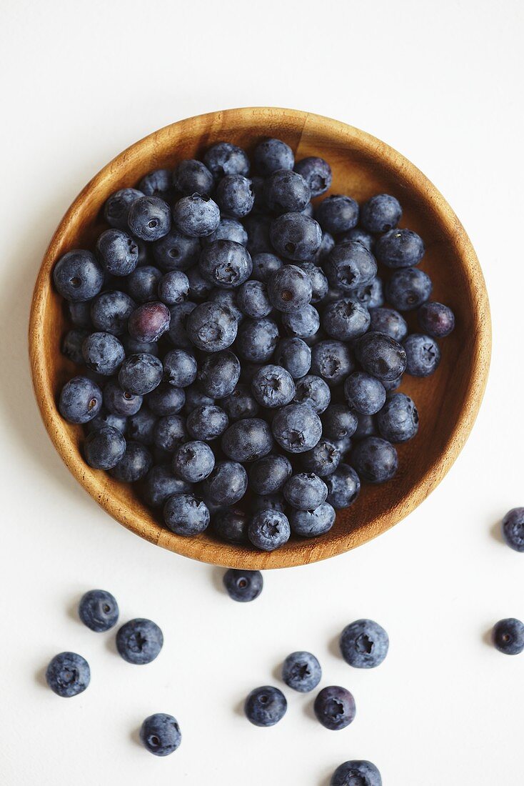 Blueberries in a wooden bowls, seen from above