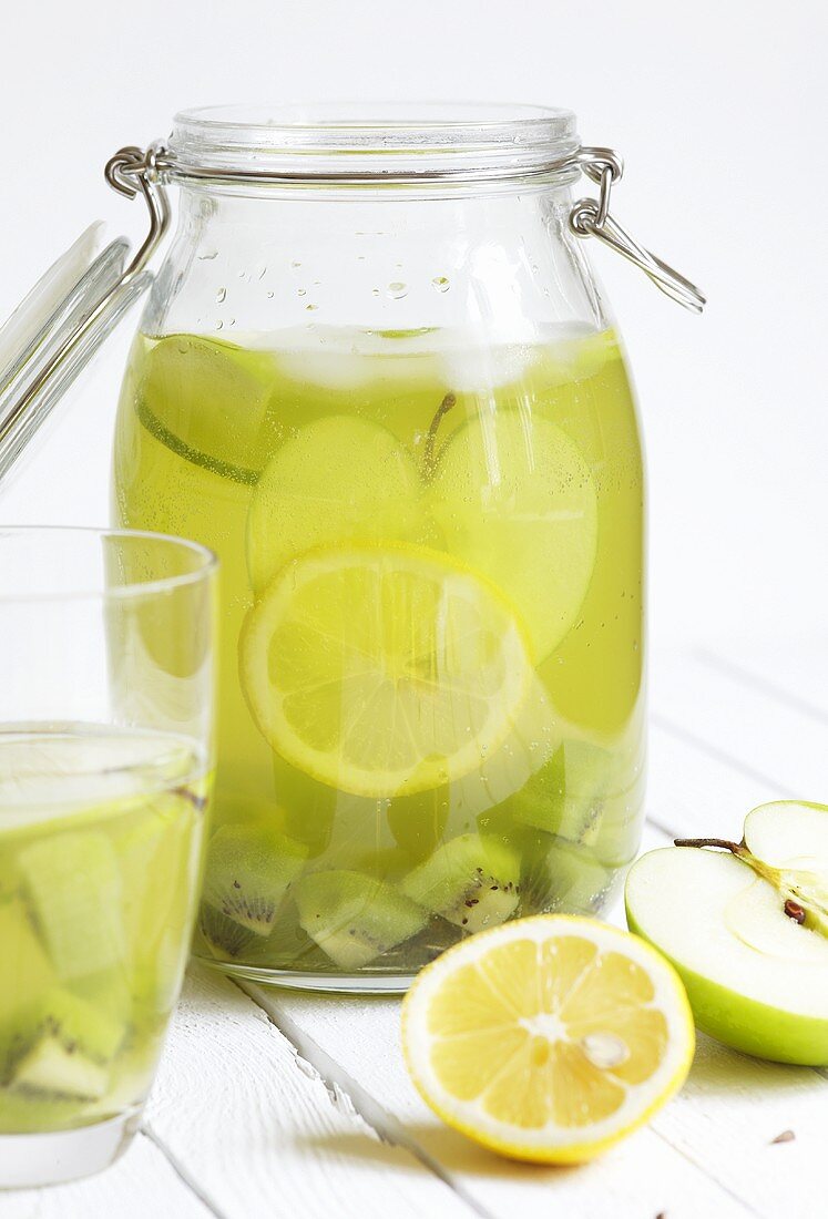 Homemade citrus lemonade with kiwis and apples
