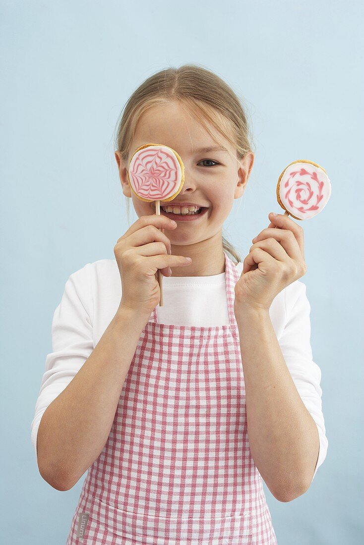 A girl with biscuit lollies