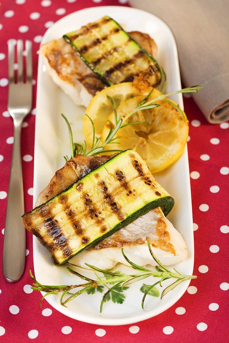 Snapper wrapped in courgettes with lemons