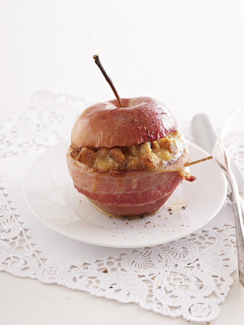 A baked apple with a bacon filling