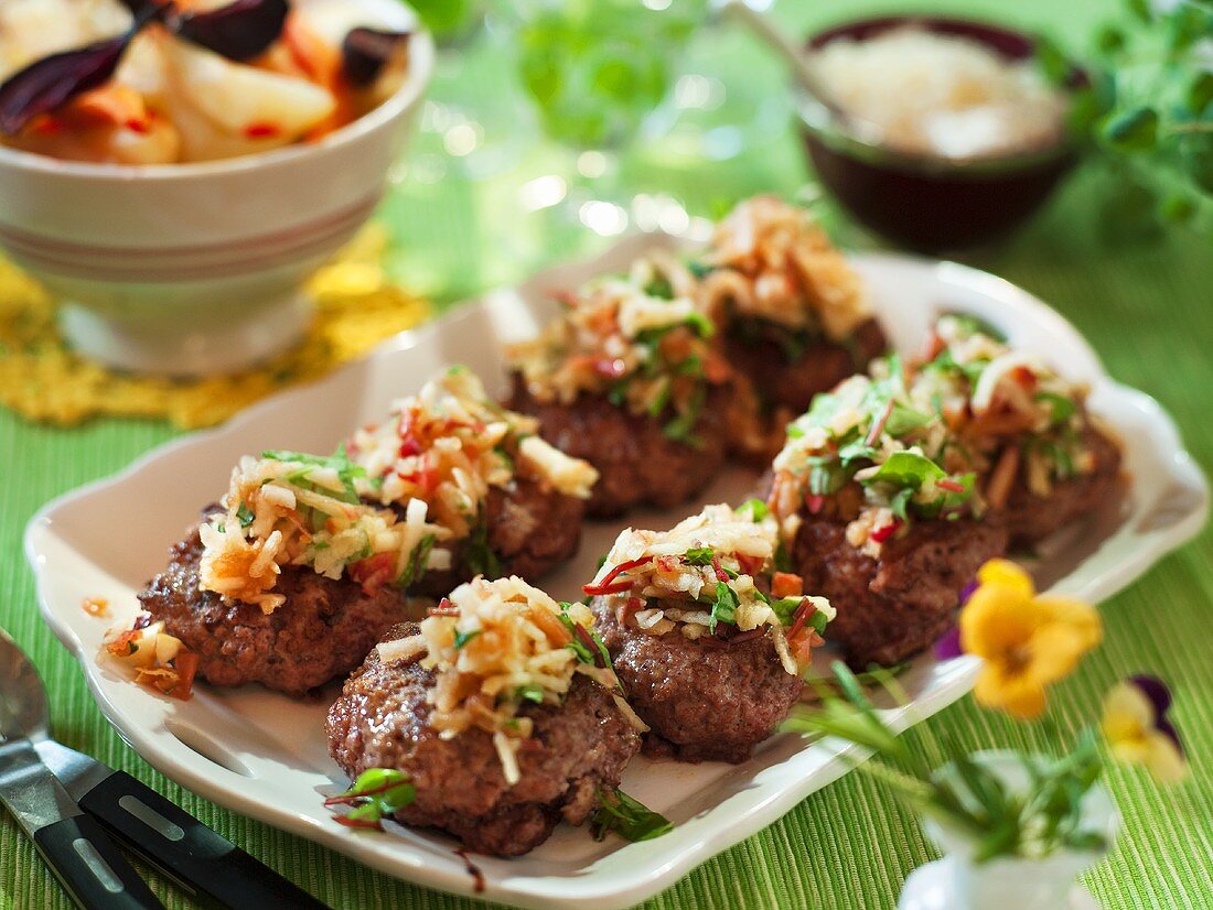Game meat balls with a vegetable and apple topping