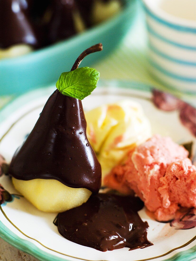 Poached pears in chocolate sauce with ice cream