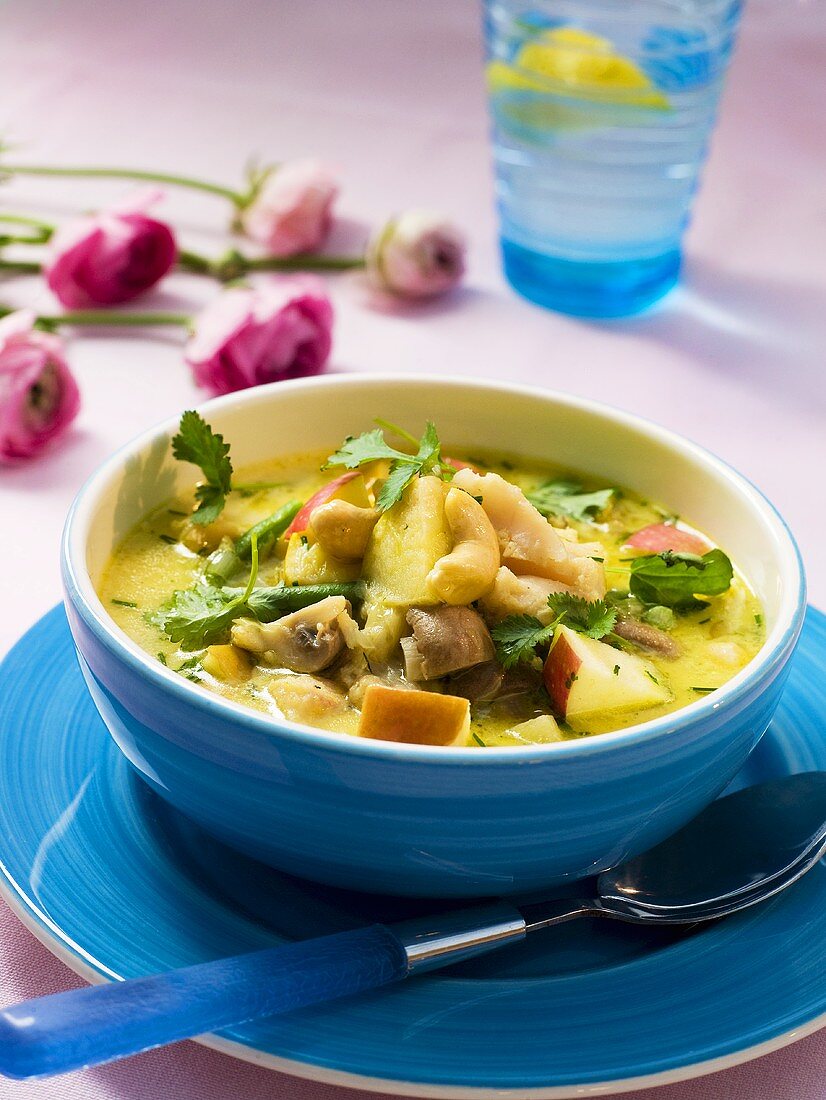 Fish soup with apples and cashew nuts