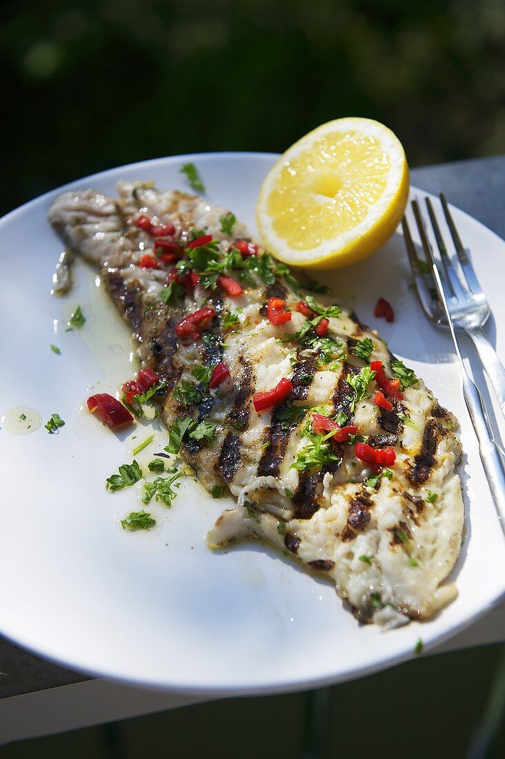 Grilled fish fillets with a pepper and herb marinade