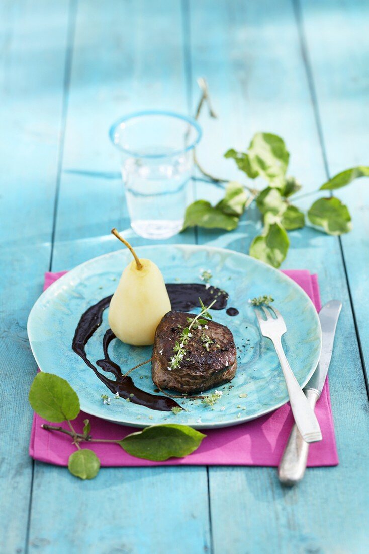 Beef fillet steak with bottled pear and elderberry sauce
