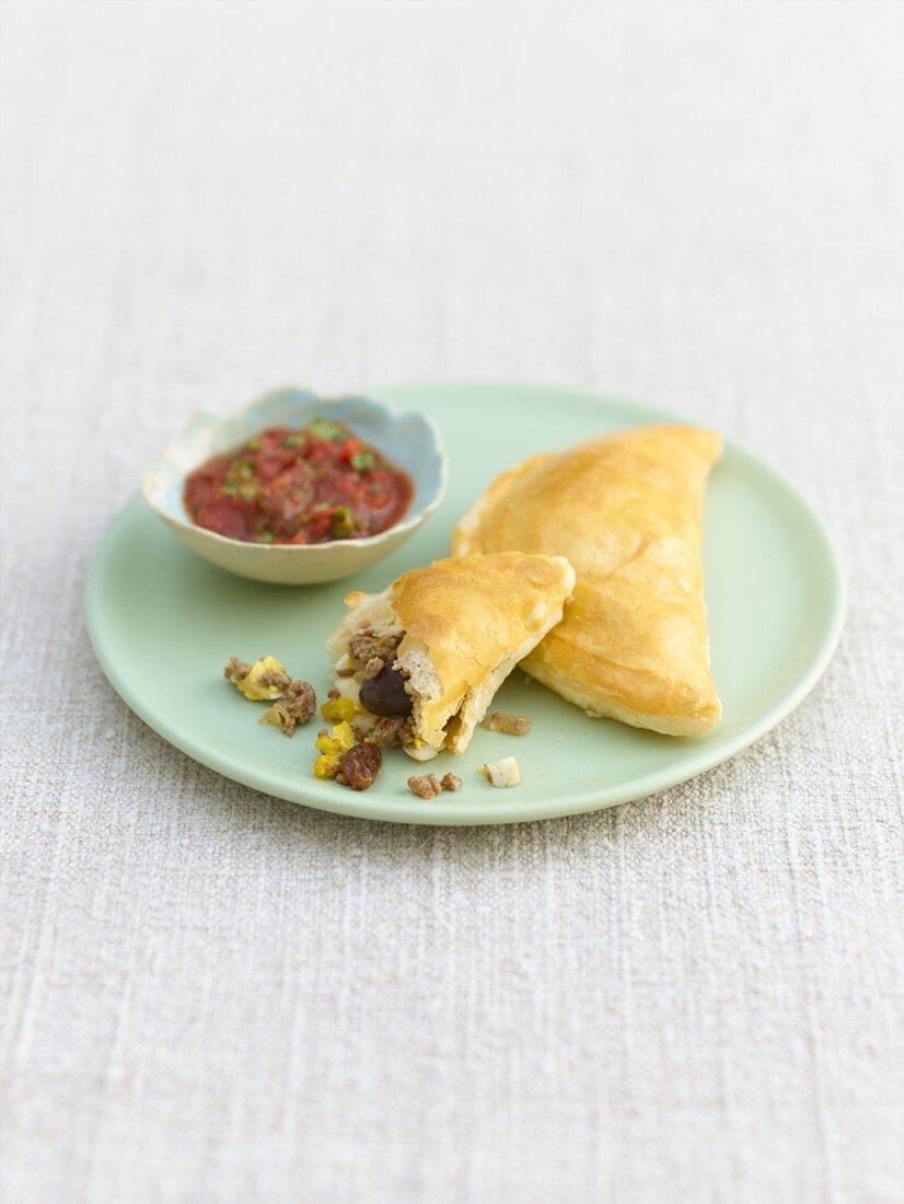 Empanadas with mince filling and tomato dip