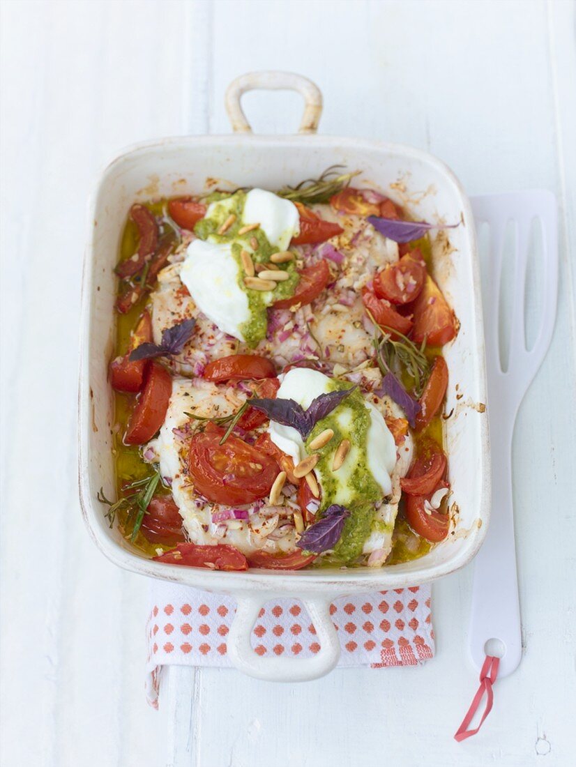 Baked coley, tomatoes and mozzarella in baking dish